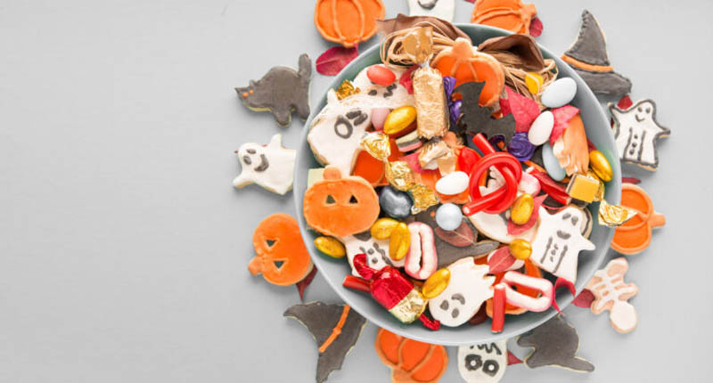 Halloween Jack o Lantern candy bowl with candy and halloween coo
