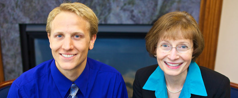 A boy and his mother smiling