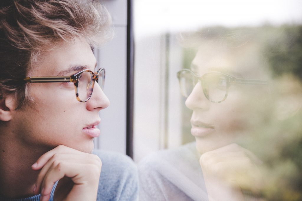Man looking out of window