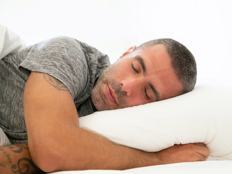 Man sleeping on a pillow.