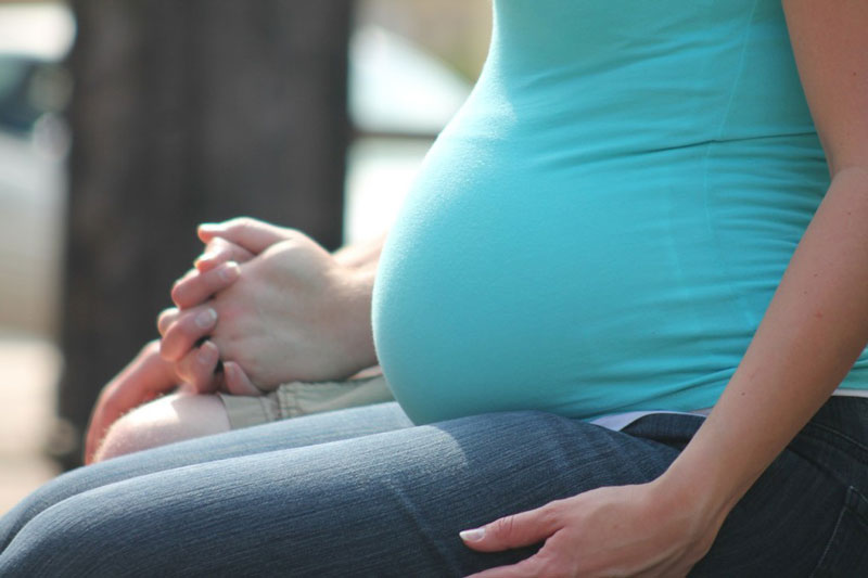 Pregnant woman sitting