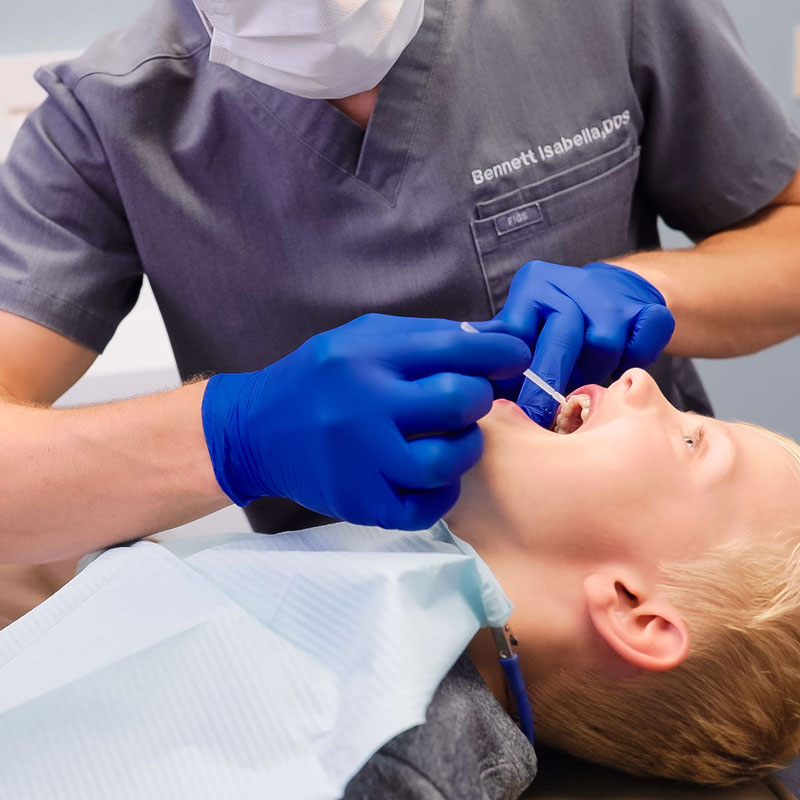 dentist applying flouride
