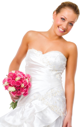 A woman in a white dress smiling