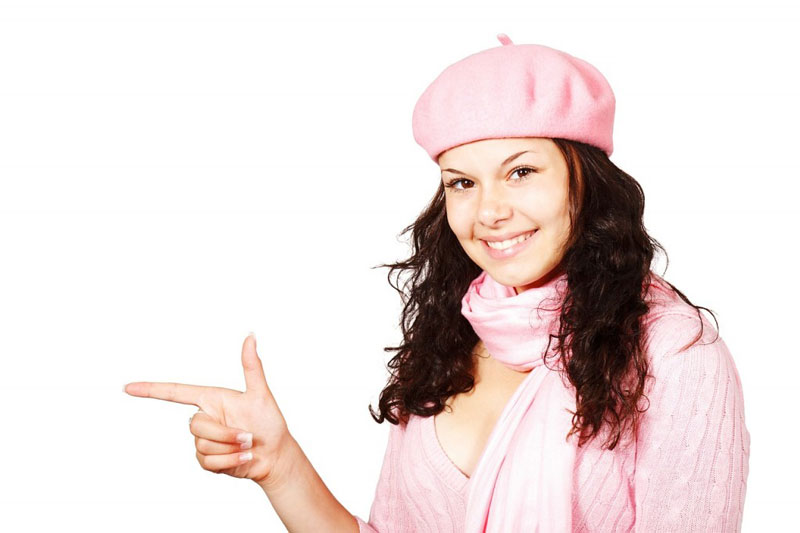 Woman pointing towards left