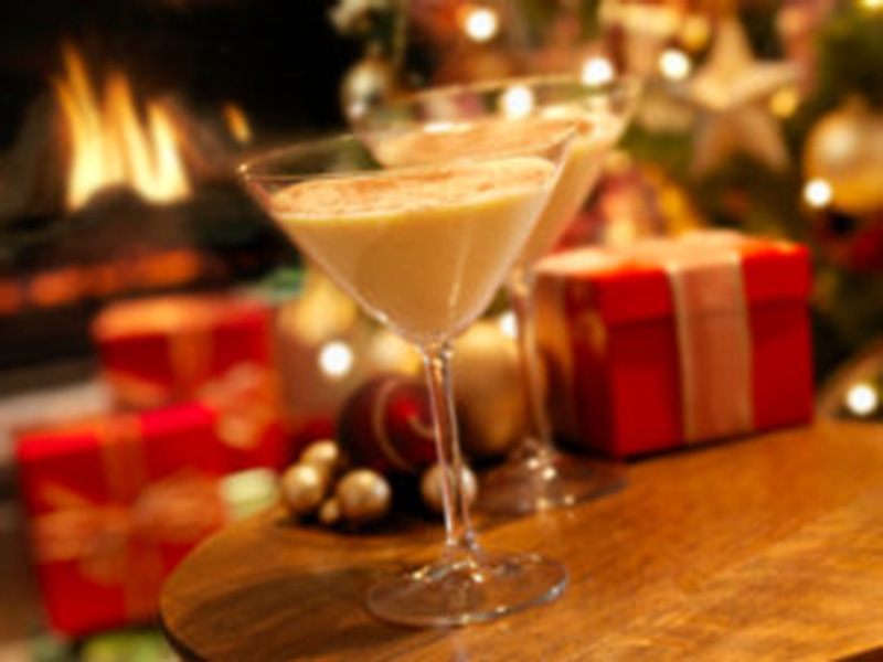 Mixed drink in front of a roaring fire