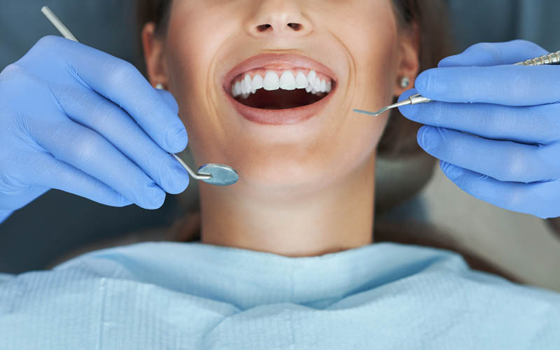 Dentist fixing a crooked smile