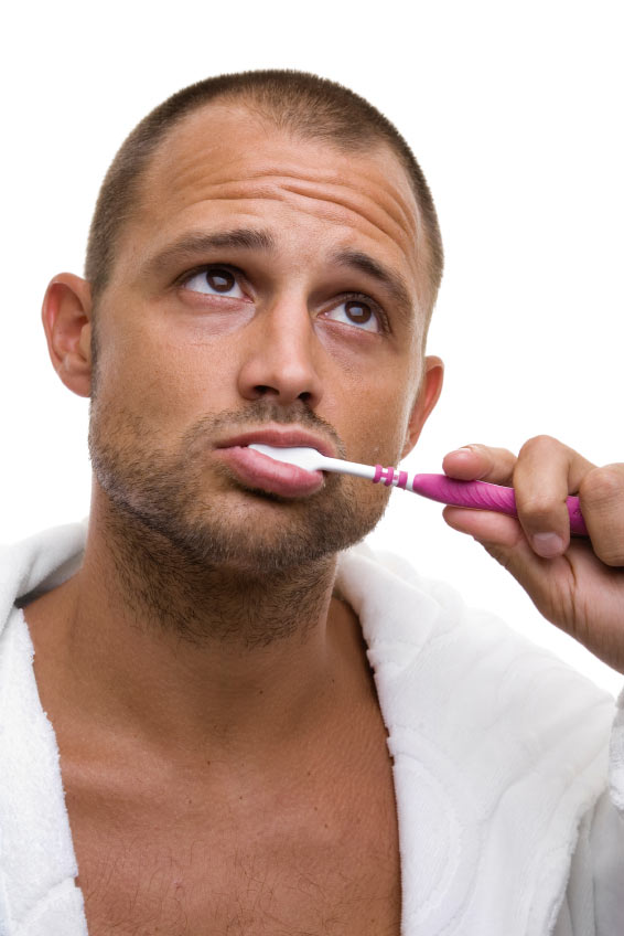man brushing teeth