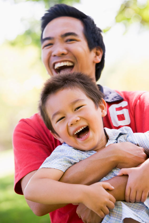 father and his son playing happily