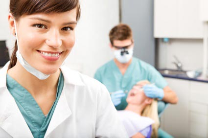 Dentist operating on a patient