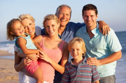 a portrait of an entire family smiling