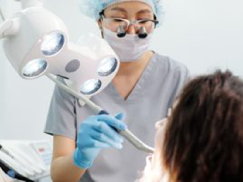 A dentist working on a patient.
