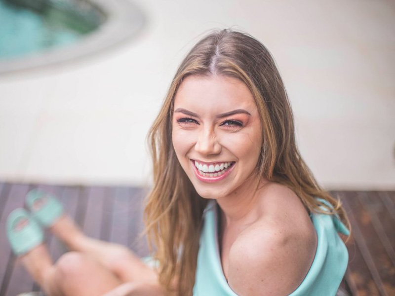 Smiling woman. Good oral health can make a big impact on your life.