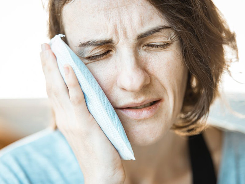 Woman with a toothache.