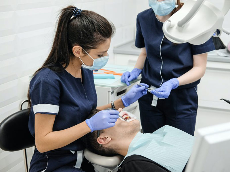 Person in dental chair during examination.