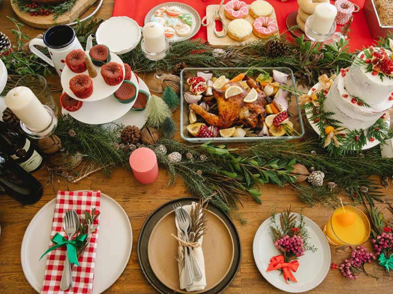 A table laid out with holiday foods.