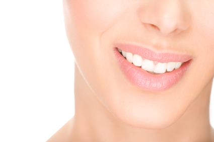A woman smiling and showing her teeth
