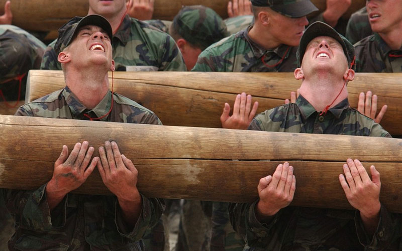 Soldiers carrying a log