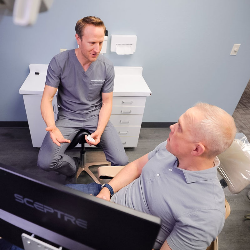 dentist talking with patient