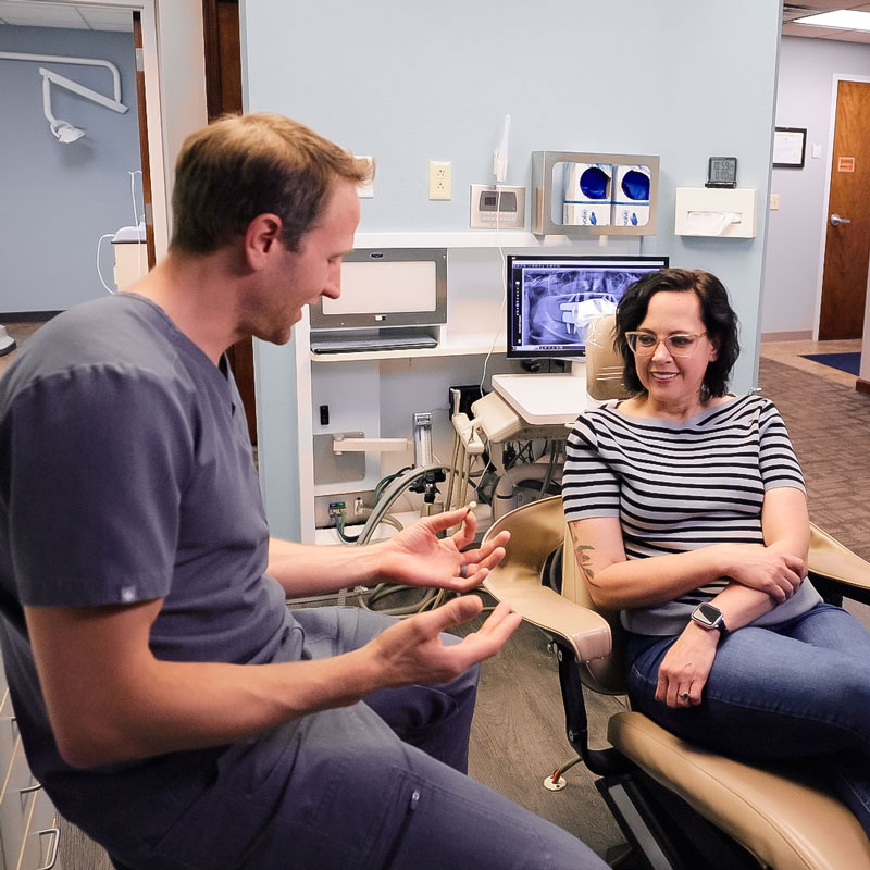 dentist talking with patient