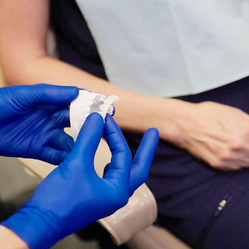 dentist showing dentures