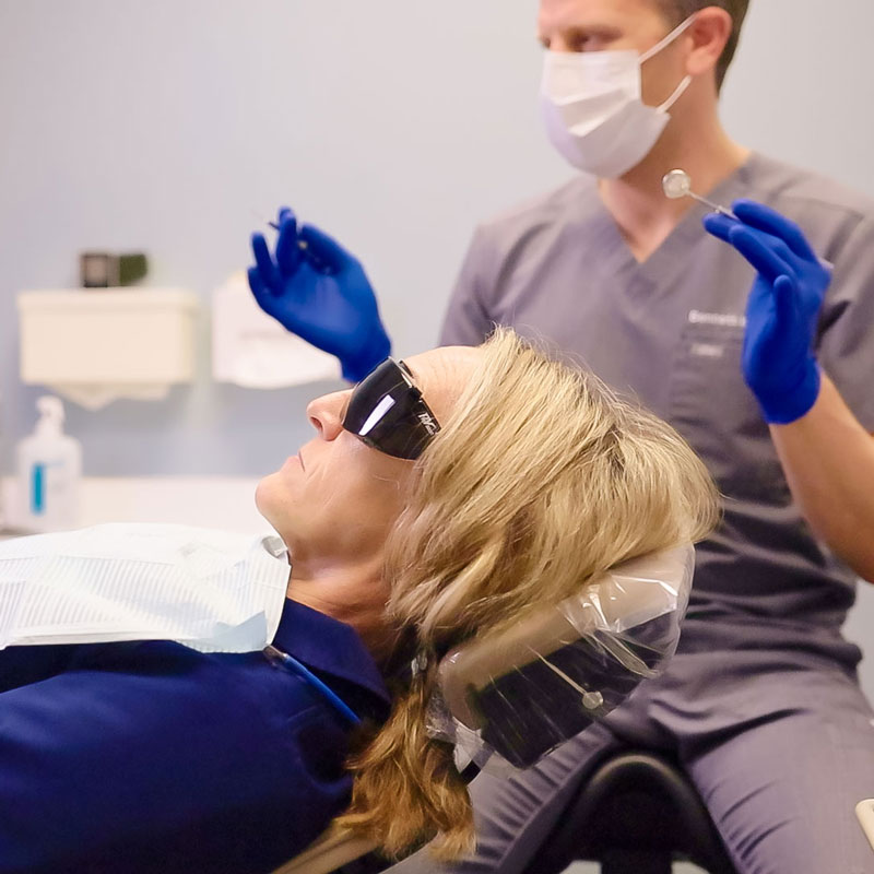 dentist and patient in dental chair