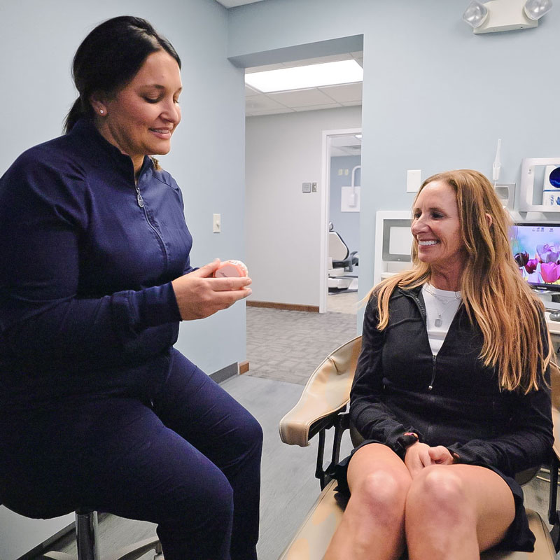 dentist talking with patient